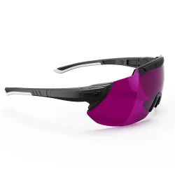 Side angle view of X Sight Sport 2RX shooting glasses, captured in a full product shot against a white background with a subtle shadow underneath. The lens color Electric Purple, is specifically tailored for clay shooting, trap shooting, or skeet shooting, offering insance green background supression and orange clay target contrast boost. The Comfort+ nose pads ensure a comfortable fit, while the adjustable temples allow for personalized adjustments. The magnetic lens change mechanism, discreetly hidden within the temples adorned by the X Sight logo, allows for effortless and quick lens swaps, making these glasses a top choice for discerning shooters.