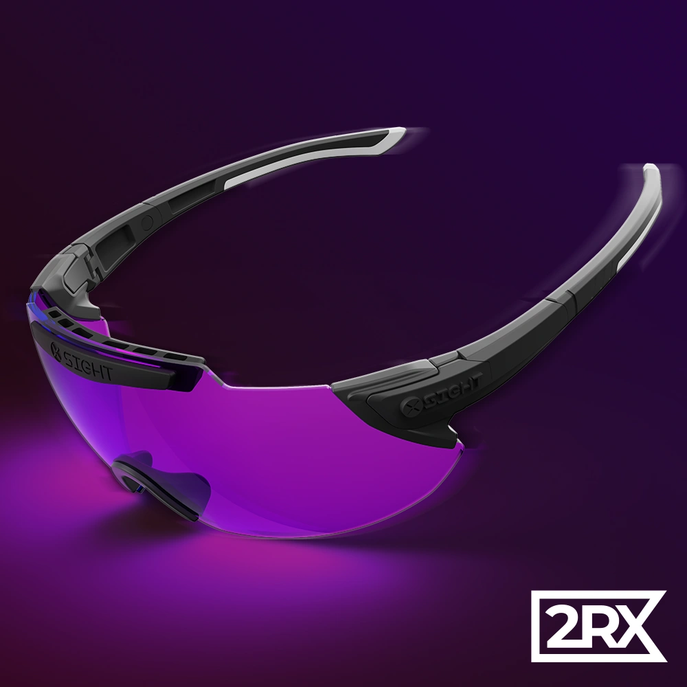 Introducing the innovative 2RX model of shooting glasses by X Sight Sport, showcased in a stunning and stylized product marketing photo. Set against a mesmerizing purple-pink gradient background, the glasses exude both elegance and functionality. The image captures the essence of these exceptional shooting glasses, highlighting their remarkable features. With over 20+ lens colors to choose from, shooters can optimize their vision for any lighting condition. The optical class one polycarbonate lenses ensure crystal-clear optics, enhancing the shooter's visual experience. The magnetic temple change function allows for easy and fast lens swapping, enabling seamless adaptation to changing shooting environments. The adjustable frame pivot provides a customized fit, ensuring comfort and stability during shooting sessions. The Comfort+ nose pads further enhance the wearing experience, offering long-lasting comfort even during extended use. Additionally, the glasses feature a ventilation bar fixed through the lens, ensuring proper airflow to prevent fogging. For shooters requiring prescription eyewear, the 2RX model offers the option of a prescription insert. The insert, cleverly held in place by the ventilation bar, allows shooters to enjoy precise vision correction without compromising on style or performance. This captivating image encapsulates the cutting-edge design and functionality of the 2RX shooting glasses, making them a must-have accessory for shooters seeking superior performance and style on the field.